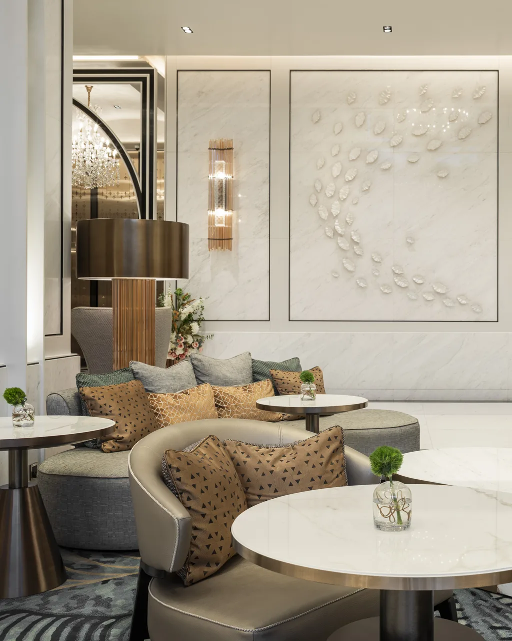 Close-up of carved wall panel and seating, hotel lobby corner