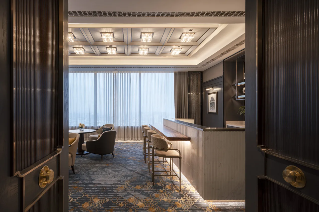 Suite • Lounge Suite lounge – doorway framing chandeliers